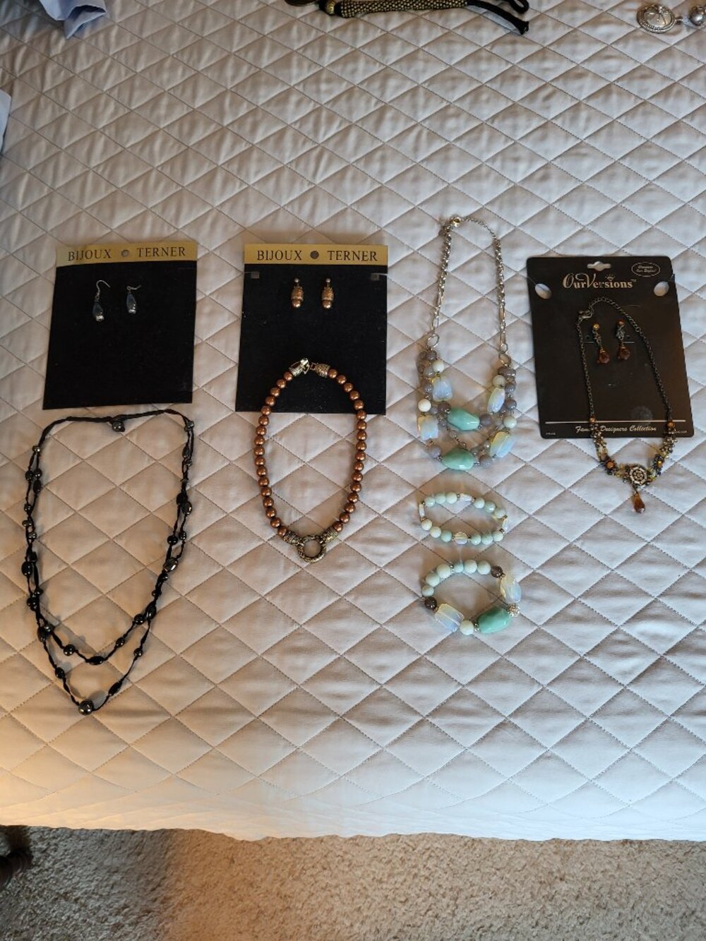 Costume jewelry set - 4 necklaces, 3 w/ear rings, 1 w/bracelets